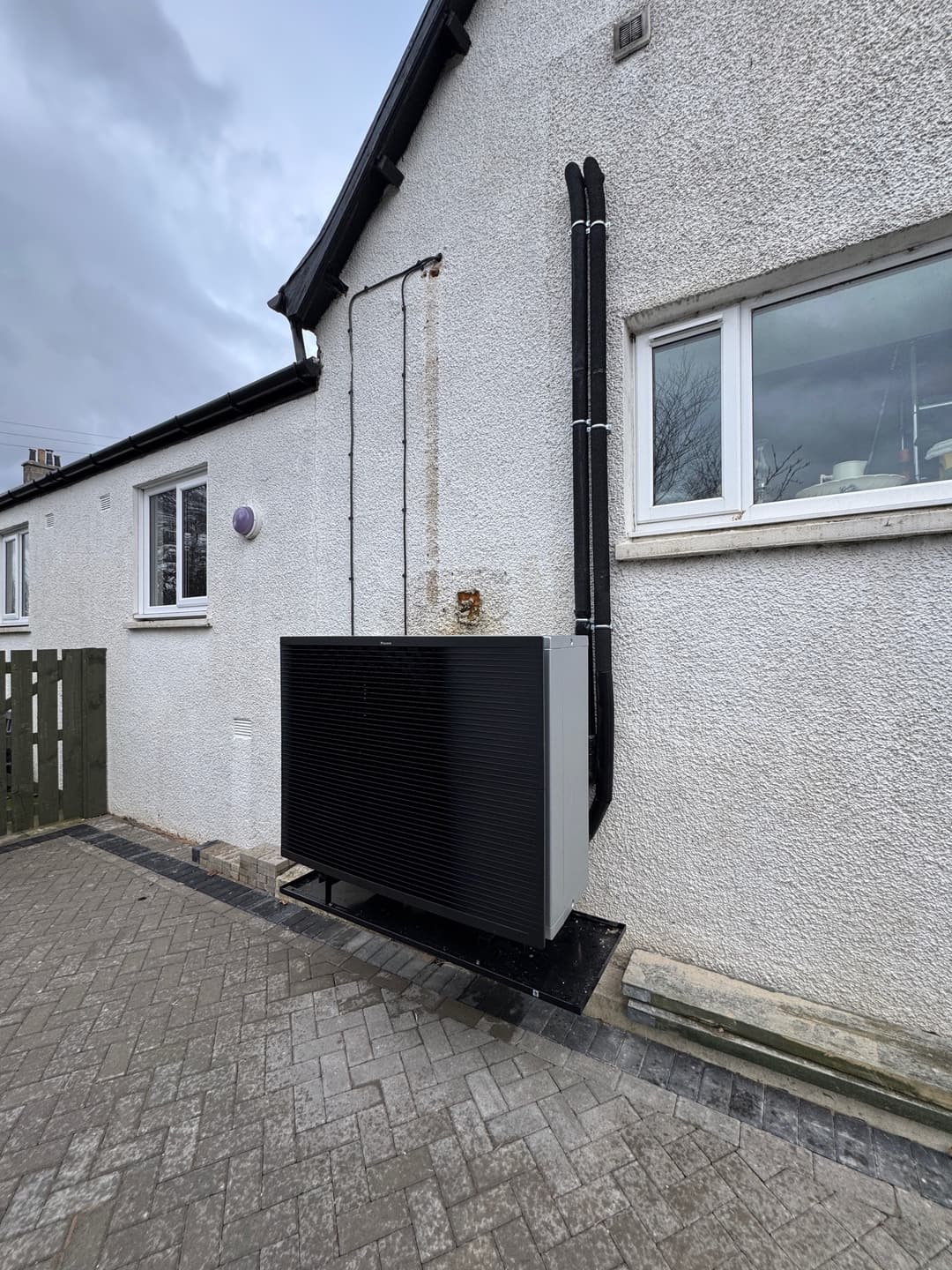 Air source heat pump installed outside a North-East Scotland home